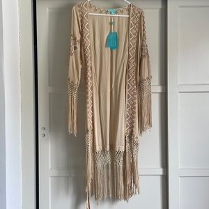 Lovely wrap with fringes, never worn.